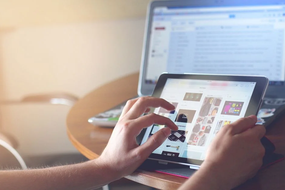 A modern workspace featuring a laptop, tablet, and smartphones, well suited for tech work and freelancing.