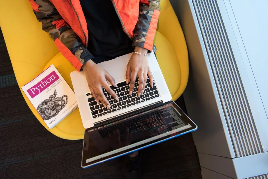 A sleek workspace with two computer monitors showing web design projects, highlighting technology and productivity.